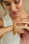 Buy_Curio Cottage_Gold Plated Ghungroo Embellished Temple Bangle_at_Aza_Fashions