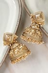 Shop_Curio Cottage_Gold Plated Embellished Handcrafted Carved Jhumka_at_Aza_Fashions