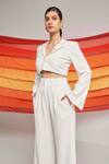 Detales_Ivory Biscuit Crepe Plain Notched Lapel Nirvana Crop Top And Pleated Trouser Set_at_Aza_Fashions