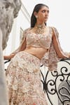 Shop_Ridhima Bhasin_Ivory Organza Embroidered 3d Flowers Aurora Floral Lehenga Cape Set  _Online_at_Aza_Fashions