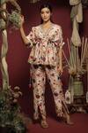 Buy_Label NE'Chi_Off White Silk Floral Patterns V-neck Peplum Top And Trouser Set_at_Aza_Fashions