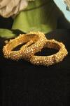 Shop Riana Jewellery Gold Plated Cut Work Carved Bangle - Set Of 2 at Aza Fashions Shop_Riana Jewellery_Gold Plated Cut Work Carved Bangle - Set Of 2 _at_Aza_Fashions