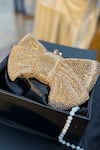 Shop_House of Bling_Gold Embellished Crystal Studded Bow Shaped Clutch _at_Aza_Fashions