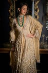 Shop_Seema Gujral_Beige Net Embroidered Cutdana Deep V Cut And Sequin Jacket Sharara Set  _at_Aza_Fashions