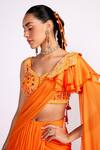 Shop_Isha Gupta Tayal_Orange Crepe Embroidery Sequins V Neck Pre-draped Saree With Blouse _Online_at_Aza_Fashions