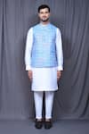 Aryavir Malhotra_Blue Art Silk Embroidered Floral Nehru Jacket And White Kurta Set _at_Aza_Fashions