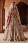 Buy_Nitika Gujral_Gold Net Embroidery Dabka V Neck Crystal Bridal Lehenga Set _at_Aza_Fashions