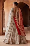 Shop_Nitika Gujral_Gold Net Embroidery Dabka V Neck Crystal Bridal Lehenga Set _at_Aza_Fashions