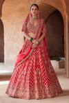 Buy_Nitika Gujral_Red Raw Silk Embroidered Zari Deep Leaf Neck Vintage Bridal Lehenga Set _at_Aza_Fashions