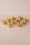 Shop_The Decor Remedy_Gold Brass Alloy Festive Tiny Urli Tea Light Floaters Set Of 10_Online_at_Aza_Fashions