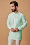 BUBBER COUTURE_Green Cotton Silk Plain Ryan Pintucked Mandarin Collar Kurta _Online_at_Aza_Fashions