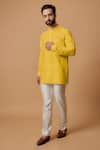 Buy_BUBBER COUTURE_Yellow Cotton Silk Plain Shlok Pintucked Mandarin Collar Kurta _at_Aza_Fashions