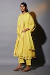 JAYATI GOENKA_Yellow Cotton Cut Work Round Neck Pleated Plain Anarkali And Trouser Set _Online_at_Aza_Fashions