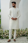 Amrit Dawani_Ivory Cotton Silk Embroidered Thread Floral Bundi Kurta Set_Online_at_Aza_Fashions