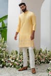 Buy_Amrit Dawani_Yellow Kurta Raw Silk Embroidered Floral Placement With Bell Bottom Pant _at_Aza_Fashions