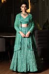 Shop_Midushi Bajoria_Green Georgette, Tulle Sequins, Cut Work V-neck Jaal Embellished Lehenga Set _at_Aza_Fashions