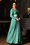 Midushi Bajoria_Green Georgette, Tulle Sequins, Cut Work V-neck Jaal Embellished Lehenga Set _Online_at_Aza_Fashions