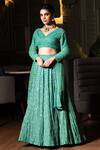 Midushi Bajoria_Green Georgette, Tulle Sequins, Cut Work V-neck Jaal Embellished Lehenga Set _at_Aza_Fashions