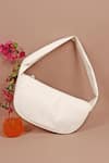 Shop_The House of Ganges_White Textured Cushy Curved Plain Handbag_Online_at_Aza_Fashions