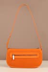 Shop_The House of Ganges_Orange Textured Pattern Daily Curved Shape Sling Bag_at_Aza_Fashions