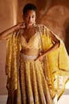 Mrunalini Rao_Yellow Paramita Hand Embroidered Lehenga Set With Cape _at_Aza_Fashions