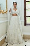 Buy_Nitika Gujral_Off White Net Embroidered Sequin Leaf Floral Pattern Bridal Lehenga Set _at_Aza_Fashions