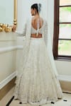 Shop_Nitika Gujral_Off White Net Embroidered Sequin Leaf Floral Pattern Bridal Lehenga Set _at_Aza_Fashions