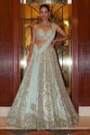 Buy_Nitika Gujral_Green Net, Satin Sequins, Crystals, Floral Bloom Embroidered Bridal Lehenga Set _at_Aza_Fashions
