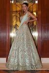 Buy_Nitika Gujral_Green Net, Satin Sequins, Crystals, Floral Bloom Embroidered Bridal Lehenga Set _Online_at_Aza_Fashions
