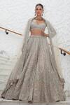 Buy_Nitika Gujral_Beige Net Embroidery Tonal Silver Flora Bloom Bridal Lehenga Set  _at_Aza_Fashions