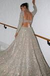 Shop_Nitika Gujral_Beige Net Embroidery Tonal Silver Flora Bloom Bridal Lehenga Set  _at_Aza_Fashions