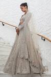 Buy_Nitika Gujral_Beige Net Embroidery Tonal Silver Flora Bloom Bridal Lehenga Set  _Online_at_Aza_Fashions