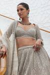 Shop_Nitika Gujral_Beige Net Embroidery Tonal Silver Flora Bloom Bridal Lehenga Set  _Online_at_Aza_Fashions