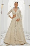 Buy_Nitika Gujral_Ivory Net Embroidery Tonal Silver Beads V Neck Lily Bloom Bridal Lehenga Set _at_Aza_Fashions