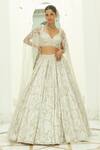 Buy_Nitika Gujral_Ivory Net Embroidery Tonal Silver Beads Floral Garden Bridal Lehenga Set _at_Aza_Fashions