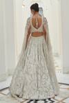 Shop_Nitika Gujral_Ivory Net Embroidery Tonal Silver Beads Floral Garden Bridal Lehenga Set _at_Aza_Fashions