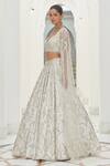 Nitika Gujral_Ivory Net Embroidery Tonal Silver Beads Floral Garden Bridal Lehenga Set _Online_at_Aza_Fashions