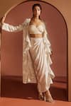 Buy_SAANJH BY LEA_Ivory Satin Embroidered Machine Aashvi Shimmer Cape Draped Skirt Set _at_Aza_Fashions