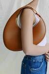 Buy_Pine And Drew_Brown Luna Crescent Shaped Handbag_at_Aza_Fashions