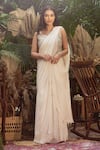 Buy_Samatvam by Anjali Bhaskar_Ivory Blended Georgette Embroidered Pearl Veera Draped Saree With Corset _at_Aza_Fashions