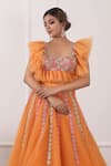 Kiran Kalsi_Orange Net Embroidery Sweetheart Neck Floral Hand Lehenga Set _Online_at_Aza_Fashions