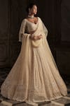 Buy_Seema Gujral_Cream Net Embroidery Crystal Plunging Neck Pearl Bridal Lehenga Set _at_Aza_Fashions