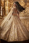 Seema Gujral_Gold Net Embroidery Crystal U And Sequin Chandelier Bridal Lehenga Set _Online_at_Aza_Fashions
