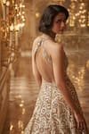 Seema Gujral_Gold Net Embroidered Sequins Deep V Neck Gown  _at_Aza_Fashions