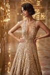 Shop_Seema Gujral_Gold Net Embroidered Sequins Deep V Neck Gown  _at_Aza_Fashions