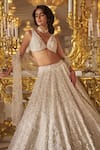 Seema Gujral_Ivory Net Embroidered Thread Deep V Neck 3d Blouse Bridal Lehenga Set _Online_at_Aza_Fashions