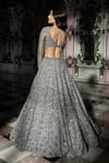 Seema Gujral_Silver Net Embroidered Sequins Plunging V Blouse Bridal Lehenga Set _Online_at_Aza_Fashions