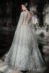 Shop_Seema Gujral_Silver Net Embroidered Sequins Plunging V Blouse Bridal Lehenga Set _at_Aza_Fashions