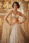 Shop_Seema Gujral_Gold Net Embroidered Sequins Leaf Neck And Crystals Bridal Lehenga Set _Online_at_Aza_Fashions