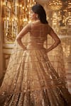 Seema Gujral_Gold Net Embroidered Sequins Sweetheart Bridal Lehenga Set _Online_at_Aza_Fashions